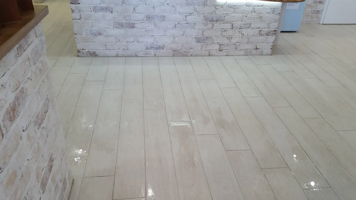 The same floor after cleaning, glossy and uniform
